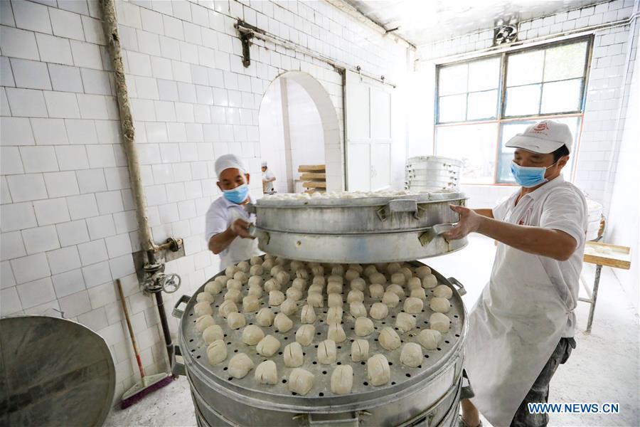 Les fameux petits pains Baoning cuits à la vapeur