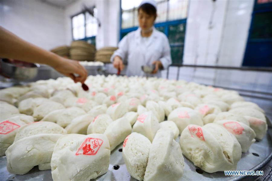 Les fameux petits pains Baoning cuits à la vapeur