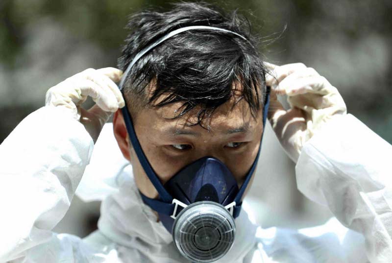 à Beijing, les travailleurs médicaux souffrent de la chaleur