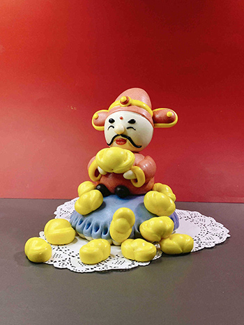 Un ma?tre du pain chinois à la vapeur célèbre la Fête du Printemps à sa fa?on